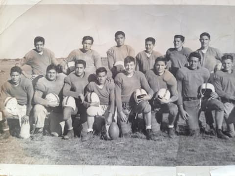 The Tex-Mex football team in the mid-1950s; Alfonso Reyes Pineda is third from left in the bottom row, and Francisco Treviño, Class of 1957, is also on the team.