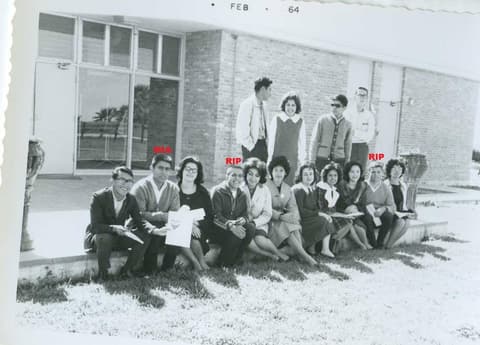 The Class of 1964 outside a classroom building in February 1964; classmates marked those who have passed, including Robert Renobato and Esteban Gamboa.