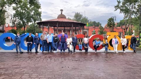 The reunion group at the Coyoacán letters by the kiosk.