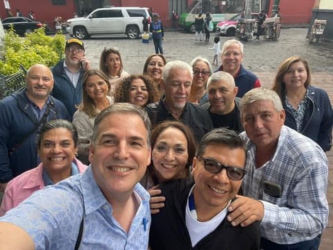 A reunion selfie on a Coyoacán street.