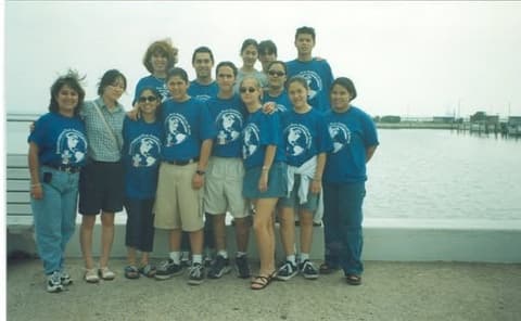 Students in matching blue Pan Am T-shirts on a trip to the coast.
