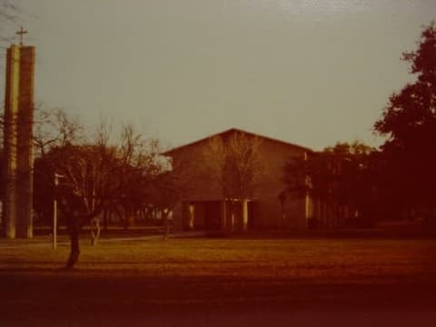 The chapel and its tower across the lawn.