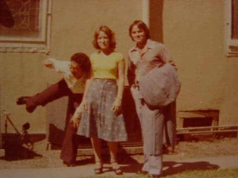 Clowning for the camera outside a church on a trip.