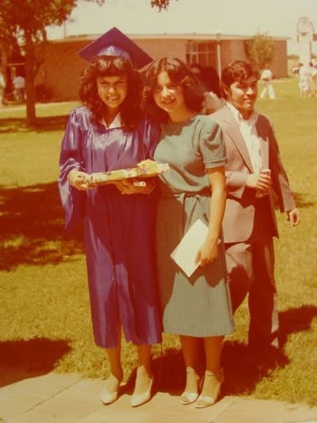 A graduate holding her gift, with her cousin and family on the lawn, 1981; the commenters are the cousins in the photo.