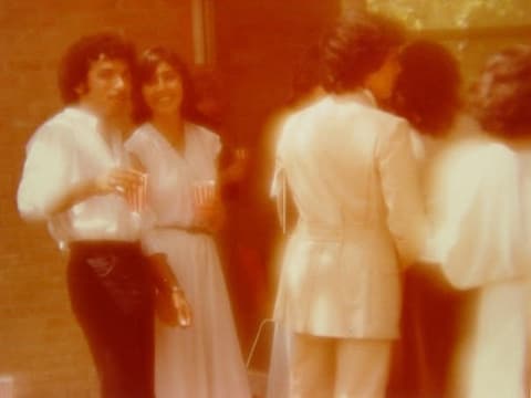 Guests at the reception on the Class of 1981’s graduation day; Jose M. Pulido recognizes his brother Juan.