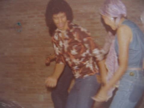Two students dancing at a Saturday night dance.
