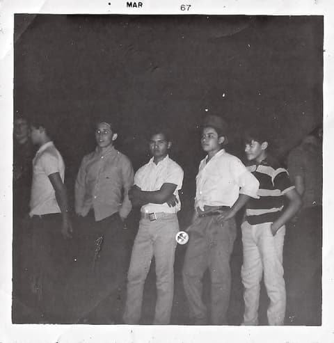 Boys at a night event, March 1967; Joe Solis, who attended for one year, has his arms crossed, and Azael Lomeli is at far right.
