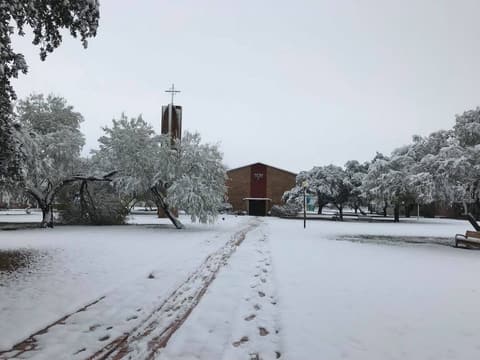 Footprints on the snowy walkway to the chapel, December 8, 2017.