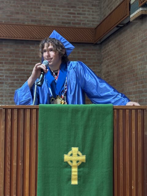 A 2026 graduate gives a speech.