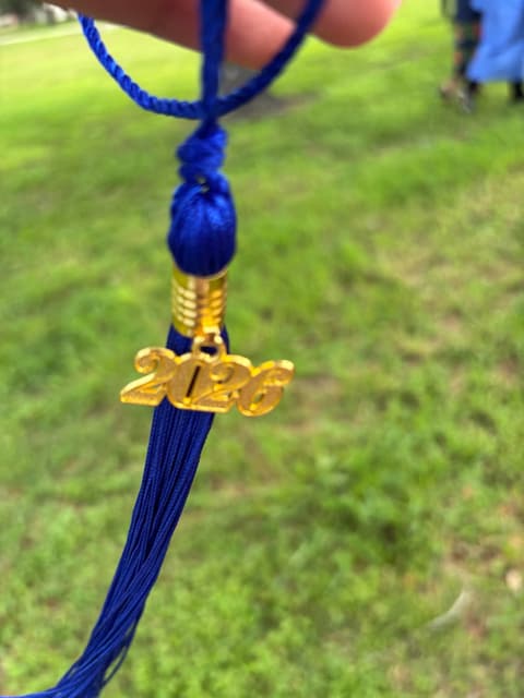 A graduate’s tassel with its gold 2026 charm.