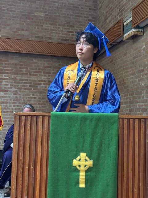 A 2026 graduate speaks from the pulpit.
