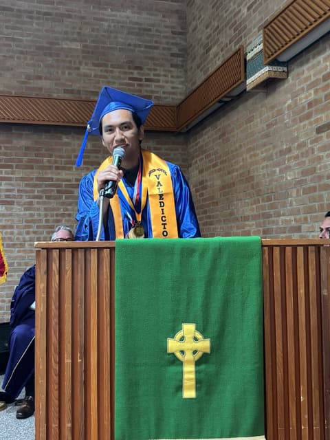 A Class of 2026 graduate speaks from the chapel pulpit.