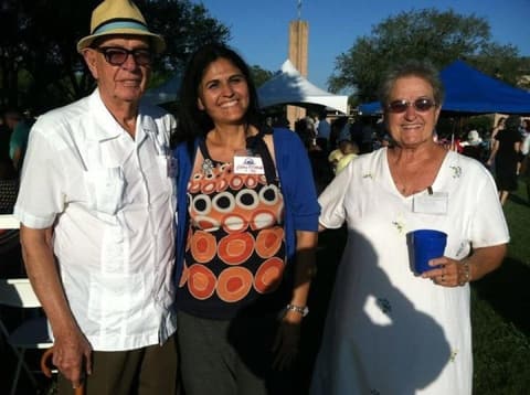 An alumna with her former teachers, Mr. and Mrs. Collins, at the reunion.