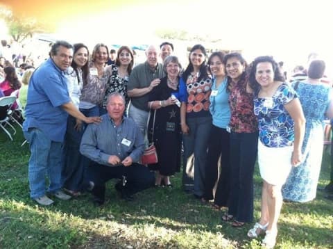 Alumni and former teachers at a campus reunion; a commenter spots Mr. and Mrs. Hudson.