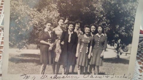 A graduating class of Pres-Mex, the Presbyterian school for Mexican girls, with their teacher around 1940; Elvira Candelaria is among them.