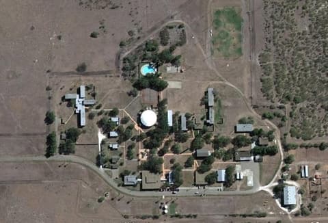A satellite view of the campus around 2011, with the domed gym at its center.