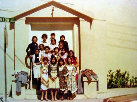 A group of students outside a small church on Willow Street during a trip, late 1970s.