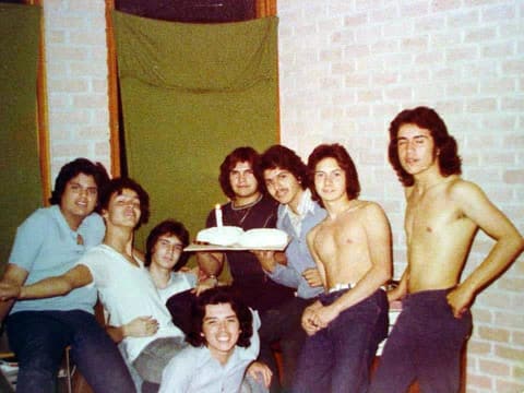 A dorm birthday with a cake and candle.
