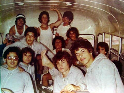 The team crowded into the bus on the way to a track meet.
