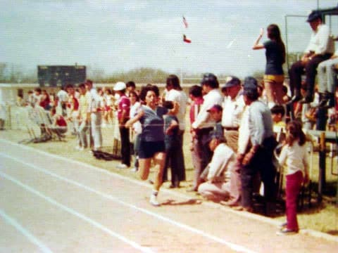 Spectators along the track at a meet.