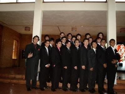 The senior boys of 2005 in suits and ties.