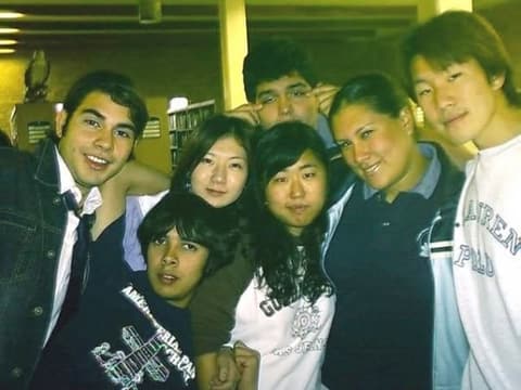 Friends crowded together in the library.