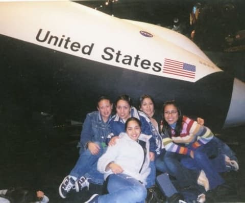 Students in front of a Space Shuttle mock-up on a school trip to NASA’s Space Center Houston.