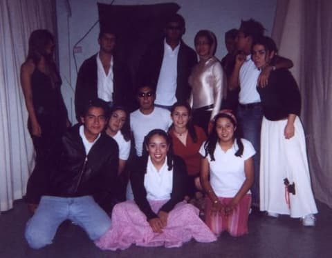 The cast of a student production of Grease.