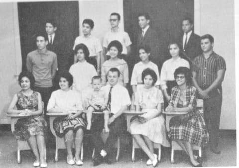 The 1963 Faith Commission, sponsored by Mr. and Mrs. Ray Stock with Ruth Casares as chair; Lucy Torres sits between Mr. Stock and Angie Rodriguez, and Rob Uribe is back row, far left.