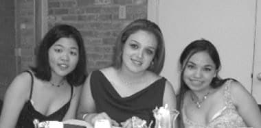 Three friends at a formal dinner.