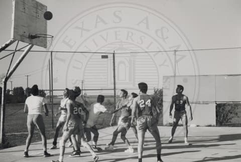 Students playing basketball.