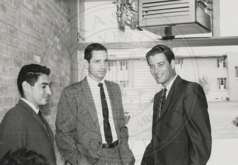 Three men in suits.