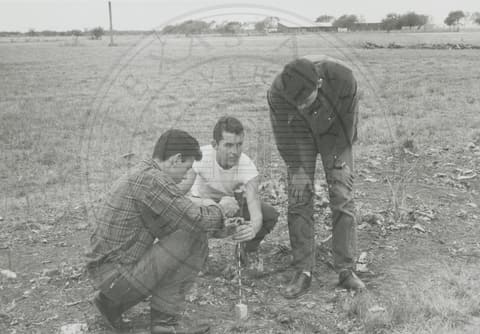 Students working on field.