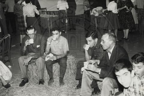 Professor and students having something to drink.