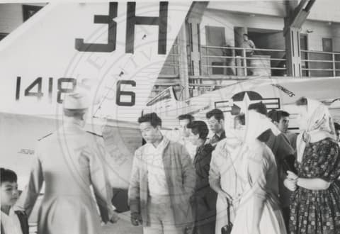 Students next to plane.