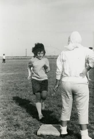 Students playing baseball.