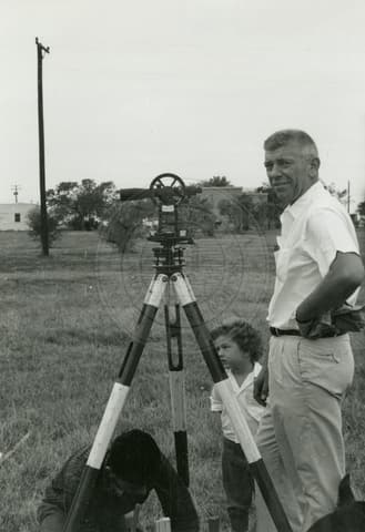 Professor with microscope.
