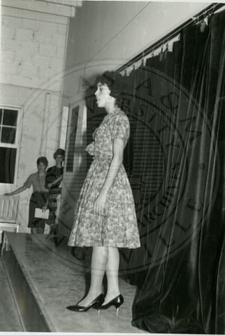 Student rehearsing on stage.