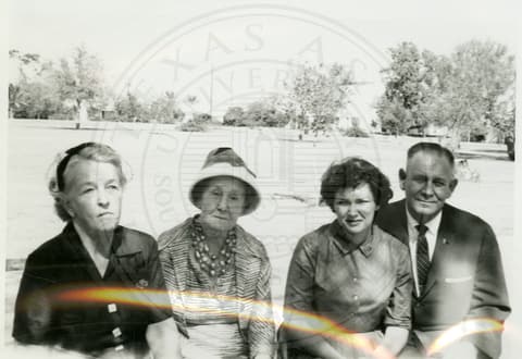 Rev. Bannor (right) and unknown ladies.