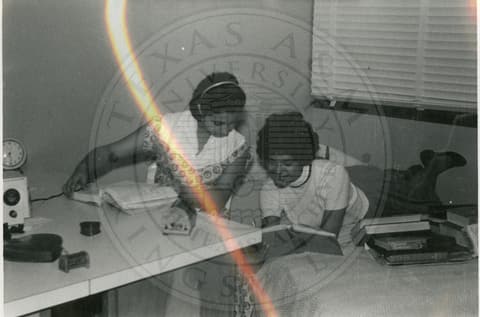 Two students on their dorm.