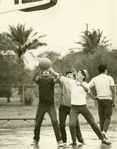 Students playing basketball.
