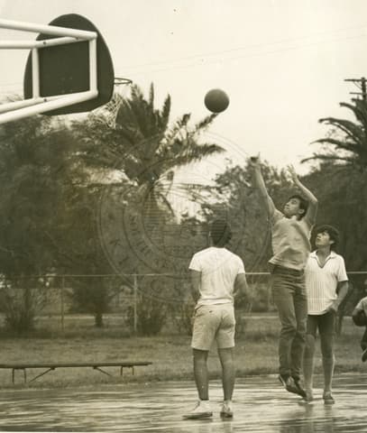 Students playing basketball.