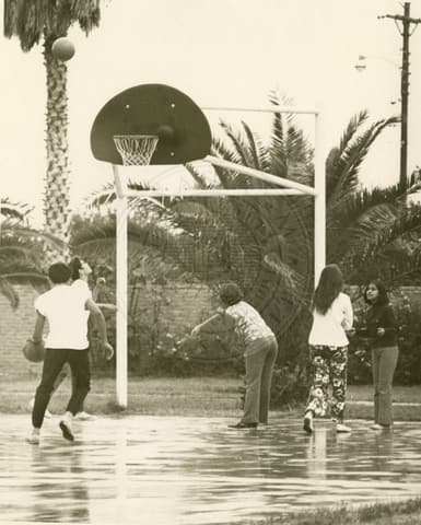 Students playing basketball.