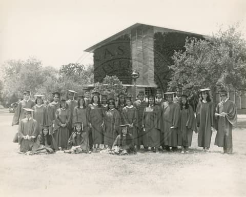 The graduating class in gowns.
