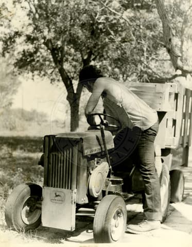On the tractor, 1970.