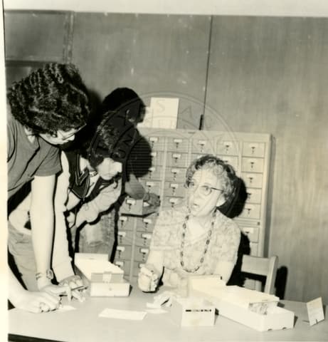 Teacher with students.