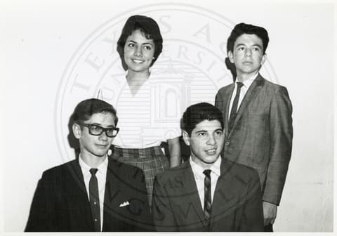 Students - Juniors. Three boys and a girl dressed in formal.
