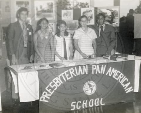 Behind the school banner, summer 1971.