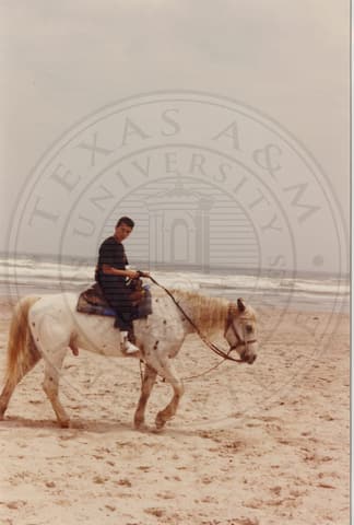 On horseback at the beach, 1990.